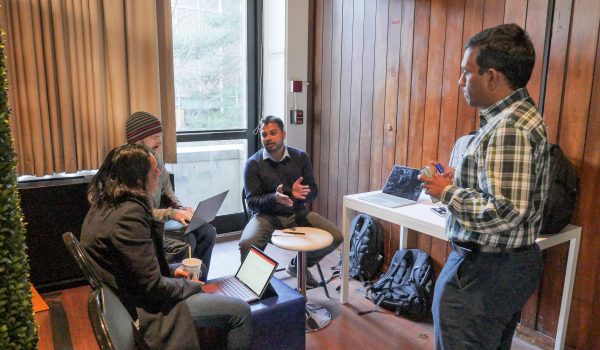 A group of students discussing a project