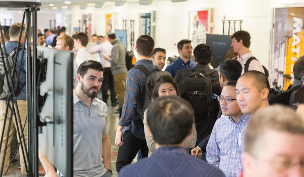 A hallway filled with students conversing