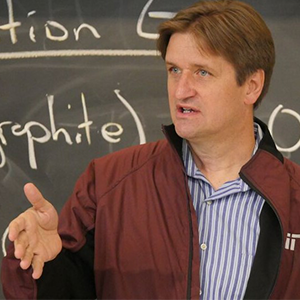 Portrait of Bryan Moser in front of a chalkboard